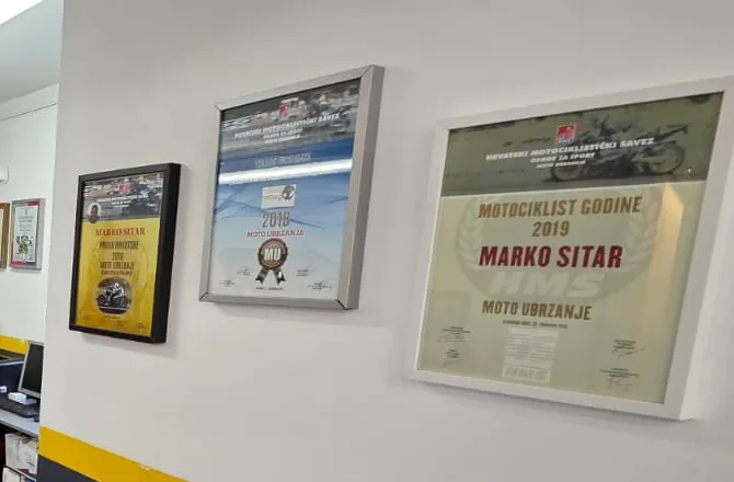 Diplome Hrvatskog motociklističkog saveza na zidu radionice: Motociklist godine 2019, Marko Sitar, moto ubrzanje